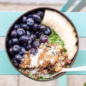 bowl of bananas, granola, coconut meat